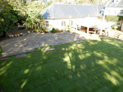 Lawn Construction in Oxshott, Surrey - Large areas of garden lawns struggling with drainage issues. Areas reduced in levels first, land drainage installed followed by the importaion of rootzone and completed areas re-turfed. Lawns & Turfing - MDB Landscapes