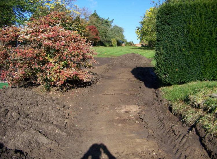 Grass Seeding in Dippenhall, Surrey - Recontouring of large areas of garden with imported topsoil and areas re-seeded on completion. Lawns & Turfing - MDB Landscapes