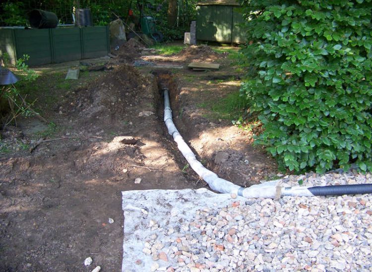Grey Water Management Winchfield, Hampshire - The clients remit here was to enable the dispersal of excess grey water within their property. The solution proposed involved the controlled discharge of grey water through a drainage layer. Garden Drainage - MDB Landscapes