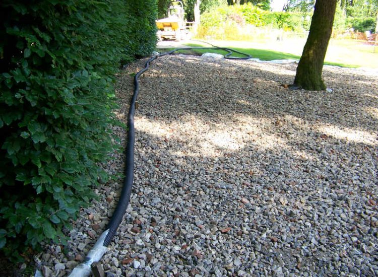 Grey Water Management Winchfield, Hampshire - The clients remit here was to enable the dispersal of excess grey water within their property. The solution proposed involved the controlled discharge of grey water through a drainage layer. Garden Drainage - MDB Landscapes