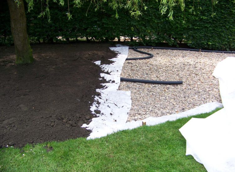 Grey Water Management Winchfield, Hampshire - The clients remit here was to enable the dispersal of excess grey water within their property. The solution proposed involved the controlled discharge of grey water through a drainage layer. Garden Drainage - MDB Landscapes