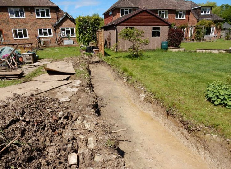 Planting Border Drainage Cranleigh, Surrey - To aid reinstatement of a new boundary hedge a bold drainage solution was required incorporating drainage layers, land drains and the use of a sump and pump. Garden drainage - MDB Landscapes