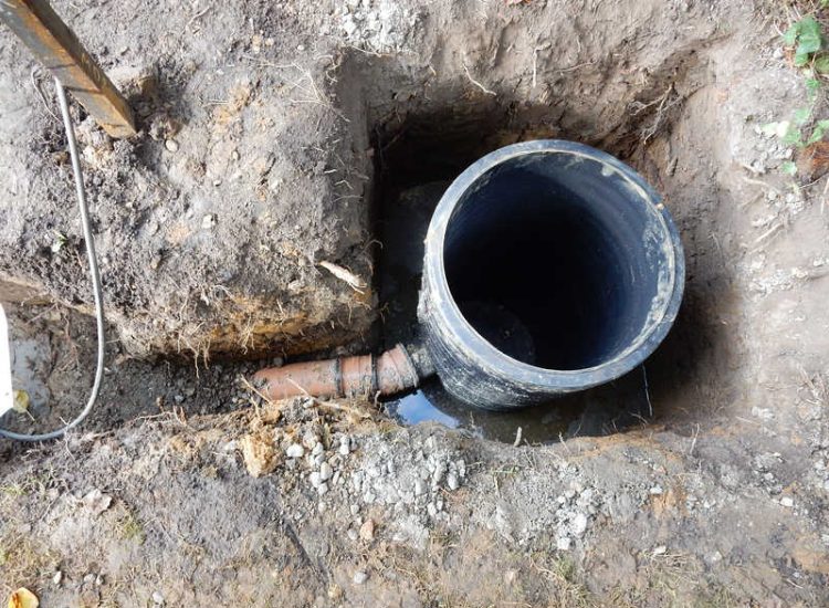 Garden and Lawn Drainage Esher, Surrey - Land drainage was installed here leading to a sump and pump to help with the issues of the clay soil type lawn. Other works included hardwood sleeper raised planting borders and driveway drainage. Garden drainage - MDB Landscapes