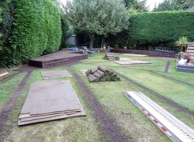 Garden and Lawn Drainage Esher, Surrey - Land drainage was installed here leading to a sump and pump to help with the issues of the clay soil type lawn. Other works included hardwood sleeper raised planting borders and driveway drainage. Garden drainage - MDB Landscapes