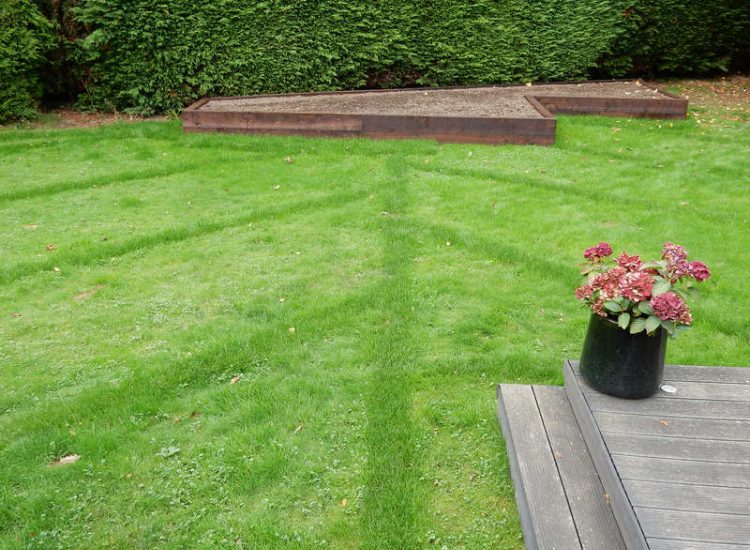 Garden and Lawn Drainage Esher, Surrey - Land drainage was installed here leading to a sump and pump to help with the issues of the clay soil type lawn. Other works included hardwood sleeper raised planting borders and driveway drainage. Garden drainage - MDB Landscapes