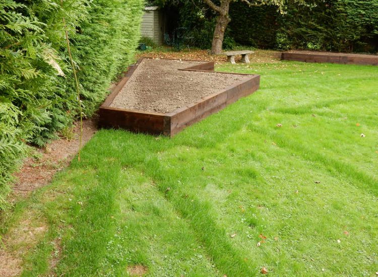 Garden and Lawn Drainage Esher, Surrey - Land drainage was installed here leading to a sump and pump to help with the issues of the clay soil type lawn. Other works included hardwood sleeper raised planting borders and driveway drainage. Garden drainage - MDB Landscapes