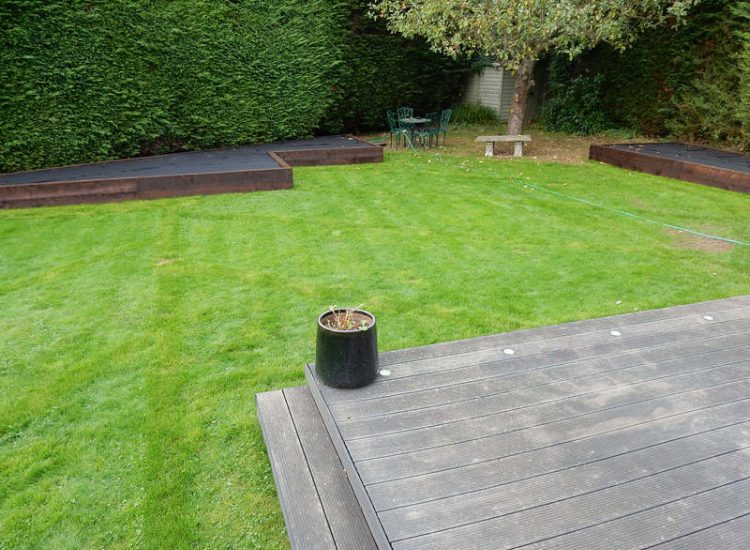 Garden and Lawn Drainage Esher, Surrey - Land drainage was installed here leading to a sump and pump to help with the issues of the clay soil type lawn. Other works included hardwood sleeper raised planting borders and driveway drainage. Garden drainage - MDB Landscapes