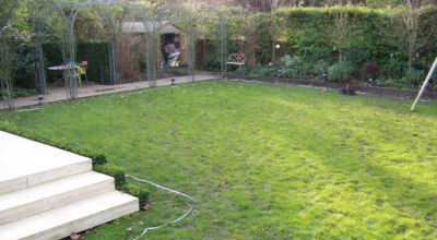 Lawn Drainage London - A poor soil medium left lawn areas very water logged and difficult to manage through out the year. Extensive land drainage was installed, new rootzone medium imported in and lawns re-turfed. Access was also restricted for this project with difficult level changes to contend with. Garden Drainage - MDB Landscapes