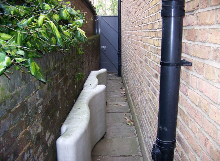 Lawn Drainage London - A poor soil medium left lawn areas very water logged and difficult to manage through out the year. Extensive land drainage was installed, new rootzone medium imported in and lawns re-turfed. Access was also restricted for this project with difficult level changes to contend with. Garden Drainage - MDB Landscapes