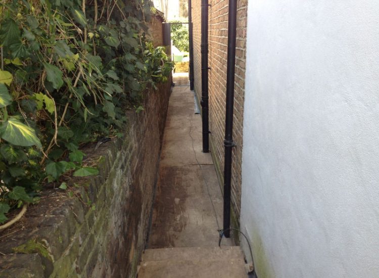 Lawn Drainage London - A poor soil medium left lawn areas very water logged and difficult to manage through out the year. Extensive land drainage was installed, new rootzone medium imported in and lawns re-turfed. Access was also restricted for this project with difficult level changes to contend with. Garden Drainage - MDB Landscapes