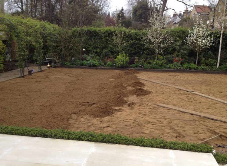 Lawn Drainage London - A poor soil medium left lawn areas very water logged and difficult to manage through out the year. Extensive land drainage was installed, new rootzone medium imported in and lawns re-turfed. Access was also restricted for this project with difficult level changes to contend with. Garden Drainage - MDB Landscapes