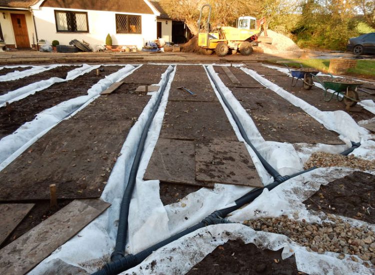 Lawn Drainage Crondall, Hampshire - Land drains, a drainage layer, raising of levels and a new lawn were required for this project to change what was an unusable front garden during both winter and summer months. Garden Drainage - MDB Landscapes
