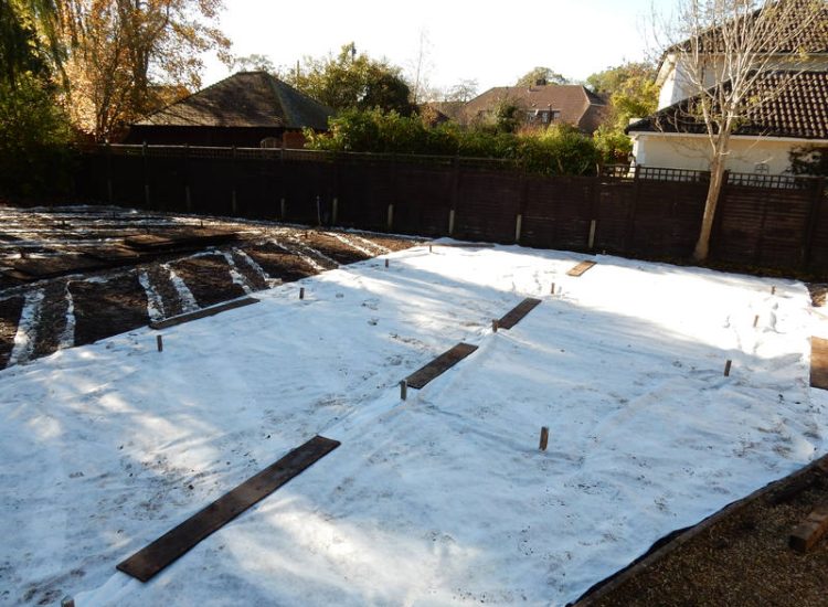 Lawn Drainage Crondall, Hampshire - Land drains, a drainage layer, raising of levels and a new lawn were required for this project to change what was an unusable front garden during both winter and summer months. Garden Drainage - MDB Landscapes