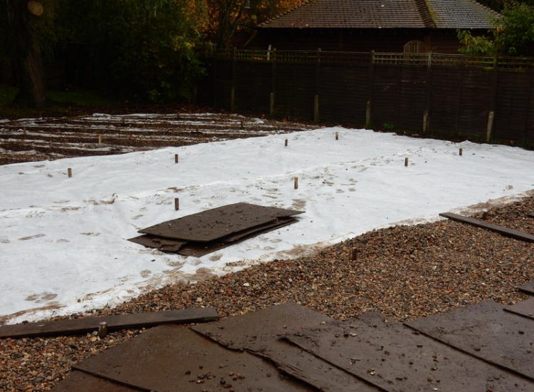 Lawn Drainage Crondall, Hampshire - Land drains, a drainage layer, raising of levels and a new lawn were required for this project to change what was an unusable front garden during both winter and summer months. Garden Drainage - MDB Landscapes