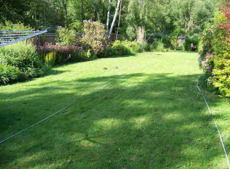 Garden and Lawn Drainage Wormley, Godalming, Surrey - With a very moisture retentive soil type and a constant in ground flow of water this garden remained unusable through out the whole year for the entire family. Garden Drainage - MDB Landscapes