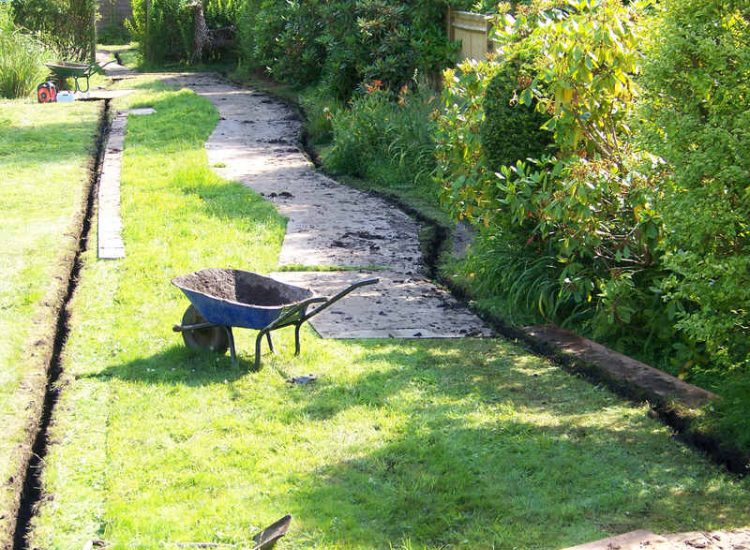 Garden and Lawn Drainage Wormley, Godalming, Surrey - With a very moisture retentive soil type and a constant in ground flow of water this garden remained unusable through out the whole year for the entire family. Garden Drainage - MDB Landscapes