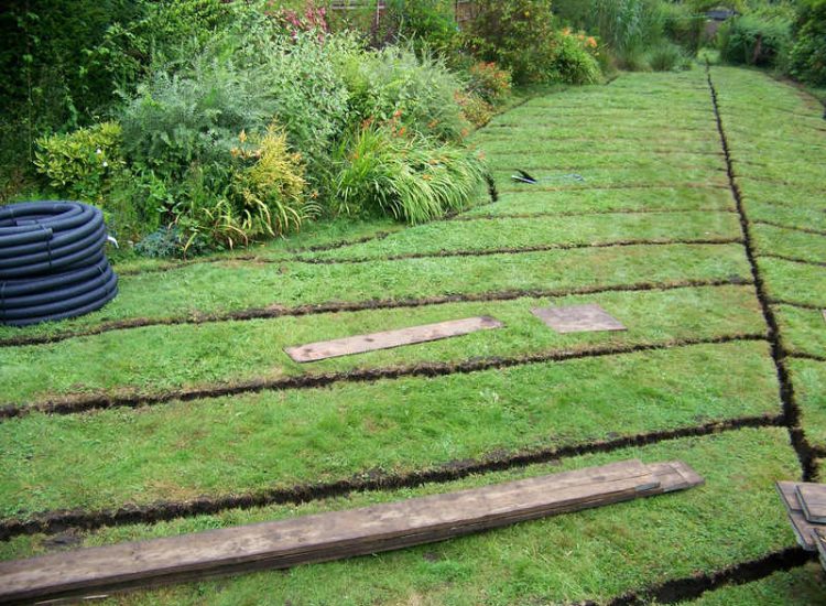 Garden and Lawn Drainage Wormley, Godalming, Surrey - With a very moisture retentive soil type and a constant in ground flow of water this garden remained unusable through out the whole year for the entire family. Garden Drainage - MDB Landscapes