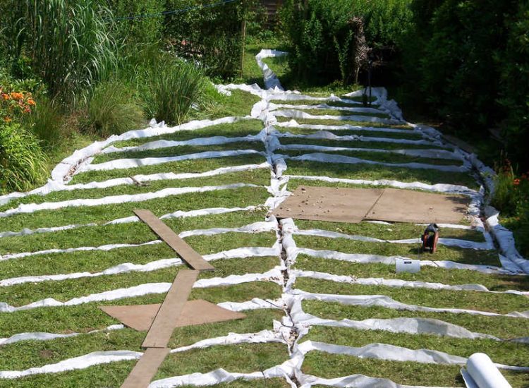 Garden and Lawn Drainage Wormley, Godalming, Surrey - With a very moisture retentive soil type and a constant in ground flow of water this garden remained unusable through out the whole year for the entire family. Garden Drainage - MDB Landscapes