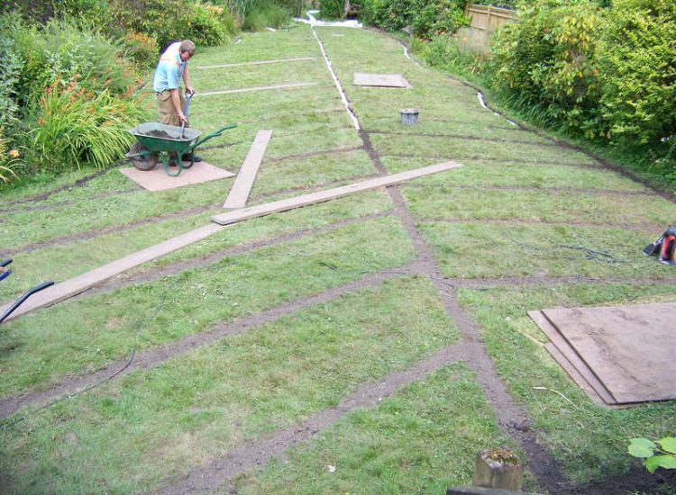 Garden and Lawn Drainage Wormley, Godalming, Surrey - With a very moisture retentive soil type and a constant in ground flow of water this garden remained unusable through out the whole year for the entire family. Garden Drainage - MDB Landscapes