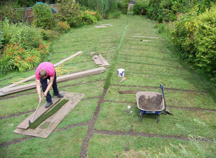 Garden and Lawn Drainage Wormley, Godalming, Surrey - With a very moisture retentive soil type and a constant in ground flow of water this garden remained unusable through out the whole year for the entire family. Garden Drainage - MDB Landscapes
