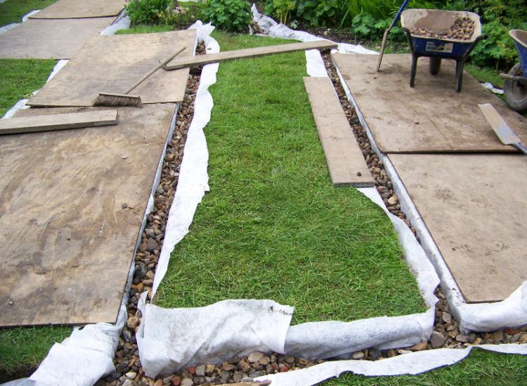 Lawn Drainage Wrecclesham, Farnham, Surrey - A constant in ground flow of water and poor water retentive soil type left the majority of this rear lawn wet and boggy. Extensive land drains were proposed and installed to great effect. The lower area of the garden was used as a discharge point for the drained water collecting first into a water reservoir. Garden Drainage - MDB Landscapes