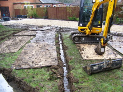 Turfing and Drainage in Winchester, Hampshire - Drainage issues were dealt with first to enable the laying of two new areas of lawn. Lawns & Turfing - MDB Landscapes