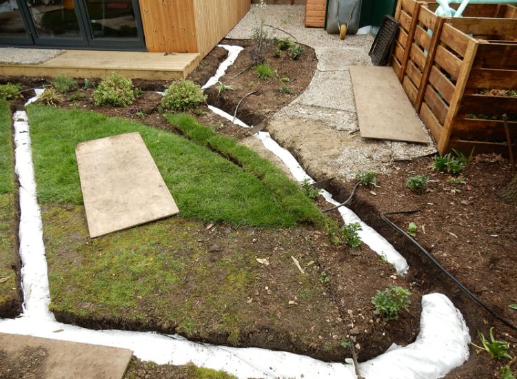 Drainage to Protect Garden Building Forest Hill, London, SE23 - A garden building installed within the lowest point of the garden with ingress from neighbouring land and the clients own garden, threatening the structure and restricting access. Drainage to Protect Garden Building Forest Hill, London, SE23 - A garden building installed within the lowest point of the garden with ingress from neighbouring land and the clients own garden, threatening the structure and restricting access.