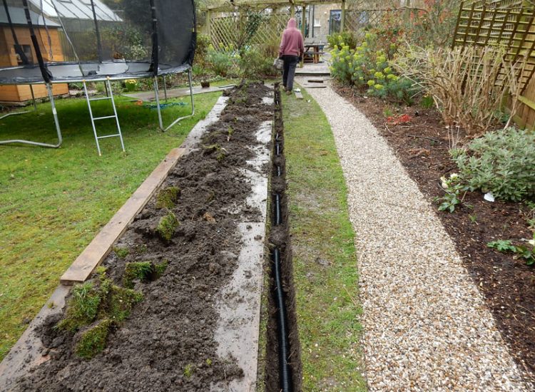 Drainage to Protect Garden Building Forest Hill, London, SE23 - A garden building installed within the lowest point of the garden with ingress from neighbouring land and the clients own garden, threatening the structure and restricting access. Drainage to Protect Garden Building Forest Hill, London, SE23 - A garden building installed within the lowest point of the garden with ingress from neighbouring land and the clients own garden, threatening the structure and restricting access.