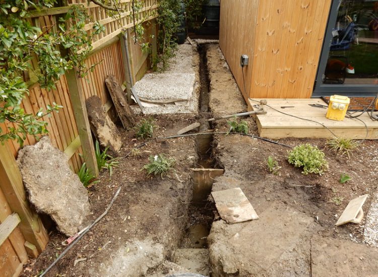 Drainage to Protect Garden Building Forest Hill, London, SE23 - A garden building installed within the lowest point of the garden with ingress from neighbouring land and the clients own garden, threatening the structure and restricting access. Drainage to Protect Garden Building Forest Hill, London, SE23 - A garden building installed within the lowest point of the garden with ingress from neighbouring land and the clients own garden, threatening the structure and restricting access.