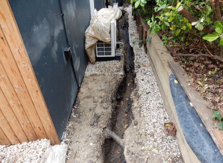 Drainage to Protect Garden Building Forest Hill, London, SE23 - A garden building installed within the lowest point of the garden with ingress from neighbouring land and the clients own garden, threatening the structure and restricting access. Drainage to Protect Garden Building Forest Hill, London, SE23 - A garden building installed within the lowest point of the garden with ingress from neighbouring land and the clients own garden, threatening the structure and restricting access.