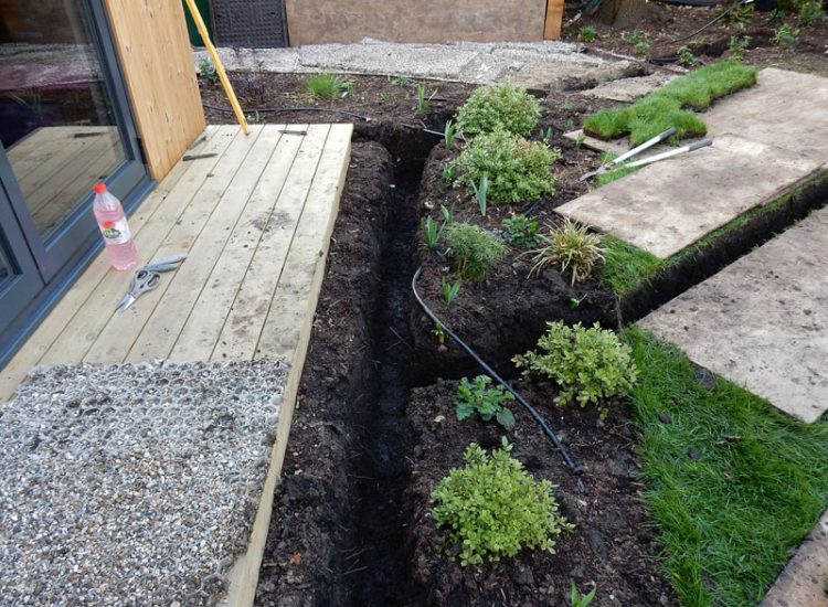 Drainage to Protect Garden Building Forest Hill, London, SE23 - A garden building installed within the lowest point of the garden with ingress from neighbouring land and the clients own garden, threatening the structure and restricting access. Drainage to Protect Garden Building Forest Hill, London, SE23 - A garden building installed within the lowest point of the garden with ingress from neighbouring land and the clients own garden, threatening the structure and restricting access.