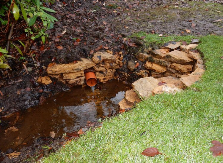 Lawn Drainage with Ditch Management Bramley, Guildford, Surrey, GU5 - Runoff from adjacent fields and neighbouring scrubland with flooding issues causing a permently boggy rear garden lawn. Lawn Drainage with Ditch Management Bramley, Guildford, Surrey, GU5 - Runoff from adjacent fields and neighbouring scrubland with flooding issues causing a permently boggy rear garden lawn.