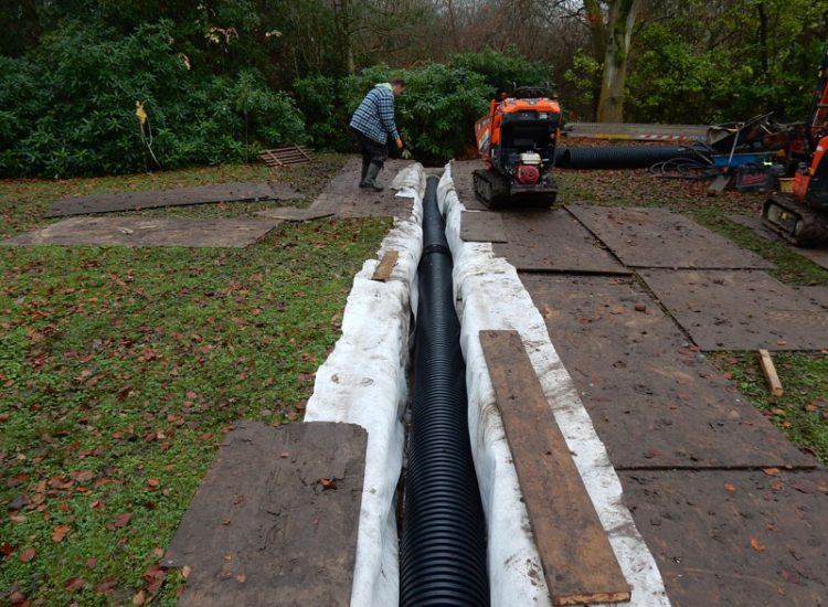 Lawn Drainage with Ditch Management Bramley, Guildford, Surrey, GU5 - Runoff from adjacent fields and neighbouring scrubland with flooding issues causing a permently boggy rear garden lawn. Lawn Drainage with Ditch Management Bramley, Guildford, Surrey, GU5 - Runoff from adjacent fields and neighbouring scrubland with flooding issues causing a permently boggy rear garden lawn.