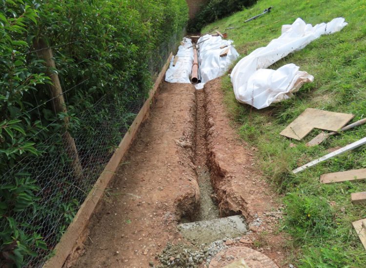 Garden Drainage in Chiddingfold, Godalming, Surrey, GU8 - Failing drainage infrastructure and runoff from a steep emabankment. Garden Drainage in Chiddingfold, Godalming, Surrey, GU8 - Failing drainage infrastructure and runoff from a steep emabankment.