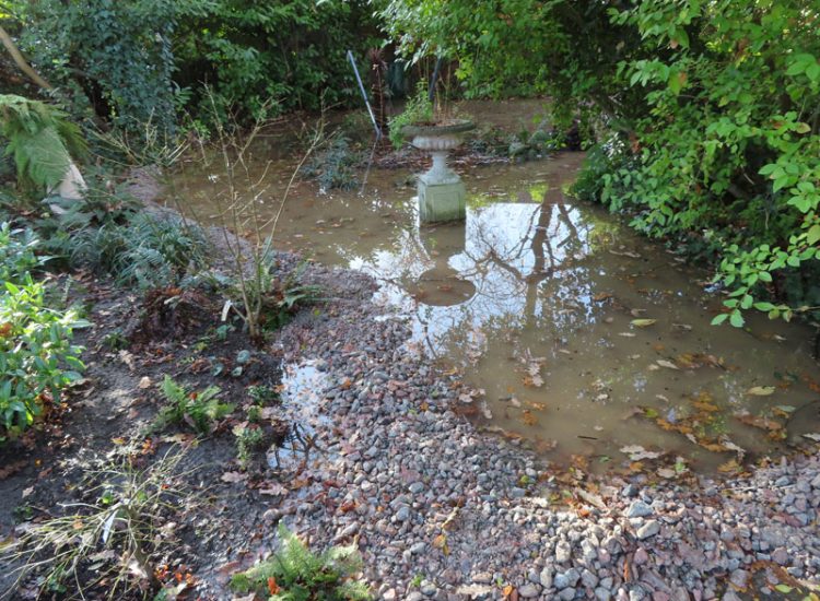 Garden Drainage and Landscaping Surbiton, Greater London, KT6 - A problematic area of garden prone to flooding due to ingress from a neighbouring property. Garden Drainage and Landscaping Surbiton, Greater London, KT6 - A problematic area of garden prone to flooding due to ingress from a neighbouring property.