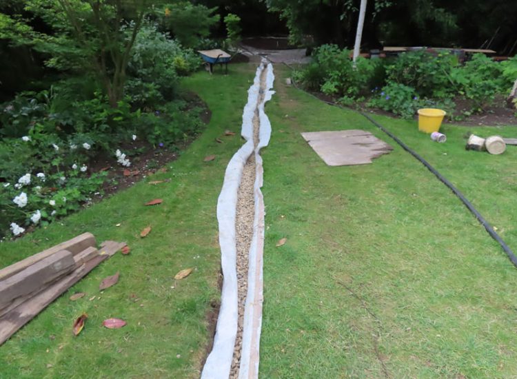 Garden Drainage and Landscaping Surbiton, Greater London, KT6 - A problematic area of garden prone to flooding due to ingress from a neighbouring property. Garden Drainage and Landscaping Surbiton, Greater London, KT6 - A problematic area of garden prone to flooding due to ingress from a neighbouring property.