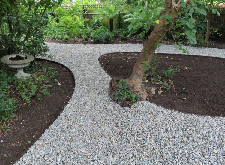 Garden Drainage and Landscaping Surbiton, Greater London, KT6 - A problematic area of garden prone to flooding due to ingress from a neighbouring property.