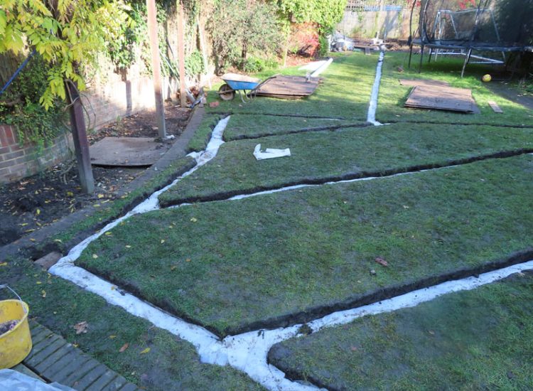 Lawn and Garden Drainage East Finchley, London, N2 - Runoff from allotments causing persistent issues creating unmanagable lawn areas and preventing installation of a garden building. Lawn and Garden Drainage East Finchley, London, N2 - Runoff from allotments causing persistent issues creating unmanagable lawn areas and preventing installation of a garden building.