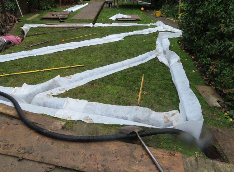 Lawn and Garden Drainage East Finchley, London, N2 - Runoff from allotments causing persistent issues creating unmanagable lawn areas and preventing installation of a garden building. Lawn and Garden Drainage East Finchley, London, N2 - Runoff from allotments causing persistent issues creating unmanagable lawn areas and preventing installation of a garden building.