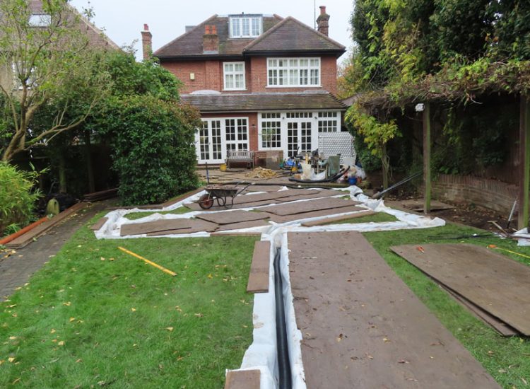Lawn and Garden Drainage East Finchley, London, N2 - Runoff from allotments causing persistent issues creating unmanagable lawn areas and preventing installation of a garden building. Lawn and Garden Drainage East Finchley, London, N2 - Runoff from allotments causing persistent issues creating unmanagable lawn areas and preventing installation of a garden building.