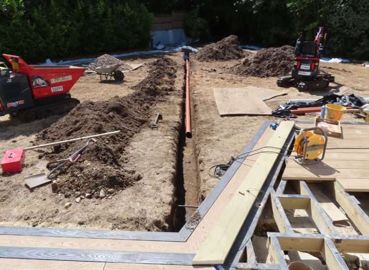 Garden and Lawn Drainage Esher, Surrey, KT10 - A previously installed drainage system which had failed to prevent flooding of lower lawn areas. Garden and Lawn Drainage Esher, Surrey, KT10 - A previously installed drainage system which had failed to prevent flooding of lower lawn areas.