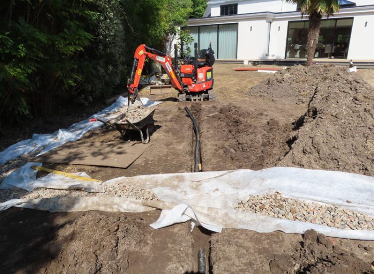 Garden and Lawn Drainage Esher, Surrey, KT10 - A previously installed drainage system which had failed to prevent flooding of lower lawn areas. Garden and Lawn Drainage Esher, Surrey, KT10 - A previously installed drainage system which had failed to prevent flooding of lower lawn areas.