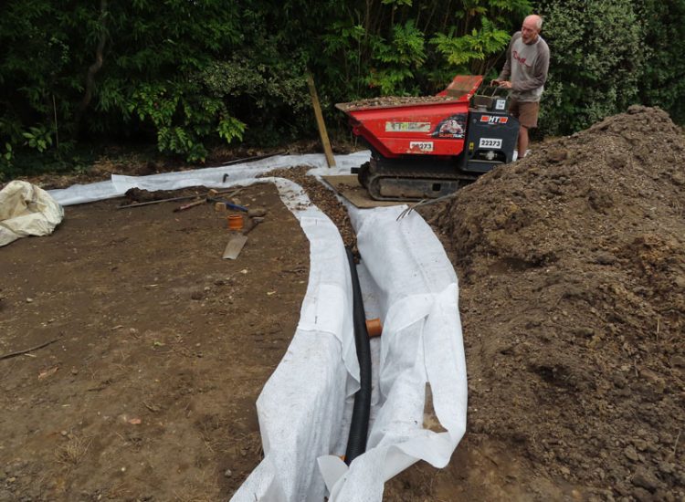 Garden and Lawn Drainage Esher, Surrey, KT10 - A previously installed drainage system which had failed to prevent flooding of lower lawn areas. Garden and Lawn Drainage Esher, Surrey, KT10 - A previously installed drainage system which had failed to prevent flooding of lower lawn areas.