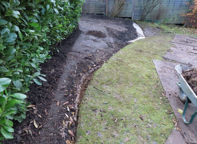 Garden and Lawn Drainage Guildford, Surrey, GU1 - Ingress from neighbouring higher ground caused by tree removal and alterations to levels, leading to flooding around the house.