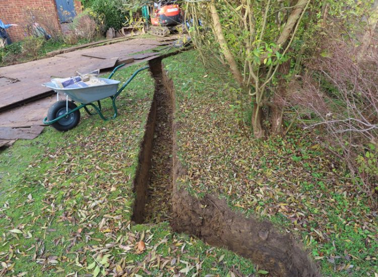 Garden and Lawn Drainage Guildford, Surrey, GU1 - Ingress from neighbouring higher ground caused by tree removal and alterations to levels, leading to flooding around the house. Garden and Lawn Drainage Guildford, Surrey, GU1 - Ingress from neighbouring higher ground caused by tree removal and alterations to levels, leading to flooding around the house.