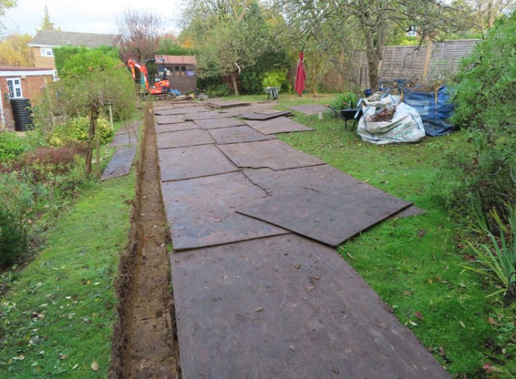 Garden and Lawn Drainage Guildford, Surrey, GU1 - Ingress from neighbouring higher ground caused by tree removal and alterations to levels, leading to flooding around the house. Garden and Lawn Drainage Guildford, Surrey, GU1 - Ingress from neighbouring higher ground caused by tree removal and alterations to levels, leading to flooding around the house.