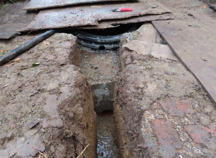 Garden and Lawn Drainage Guildford, Surrey, GU1 - Ingress from neighbouring higher ground caused by tree removal and alterations to levels, leading to flooding around the house. Garden and Lawn Drainage Guildford, Surrey, GU1 - Ingress from neighbouring higher ground caused by tree removal and alterations to levels, leading to flooding around the house.