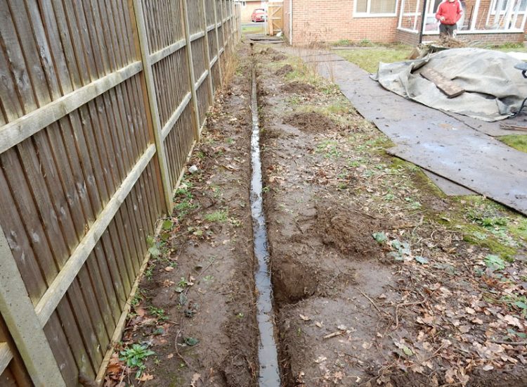 Garden and Lawn Drainage Liss, Hampshire, GU33 - A moderately sized rear garden backing onto and near a pond with its surround set higher than the rear garden. Garden and Lawn Drainage Liss, Hampshire, GU33 - A moderately sized rear garden backing onto and near a pond with its surround set higher than the rear garden.