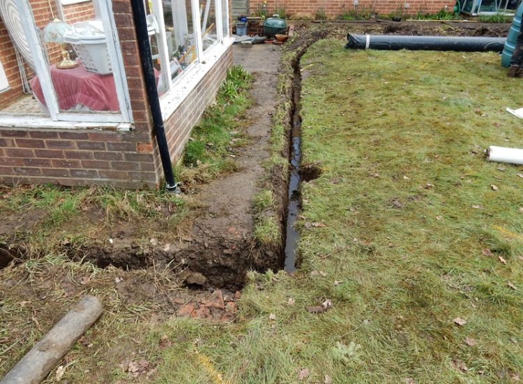 Garden and Lawn Drainage Liss, Hampshire, GU33 - A moderately sized rear garden backing onto and near a pond with its surround set higher than the rear garden. Garden and Lawn Drainage Liss, Hampshire, GU33 - A moderately sized rear garden backing onto and near a pond with its surround set higher than the rear garden.