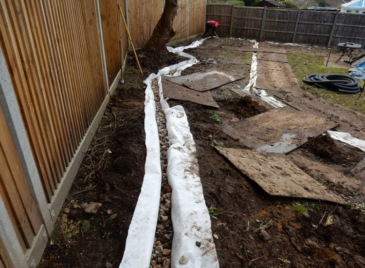 Garden and Lawn Drainage Liss, Hampshire, GU33 - A moderately sized rear garden backing onto and near a pond with its surround set higher than the rear garden. Garden and Lawn Drainage Liss, Hampshire, GU33 - A moderately sized rear garden backing onto and near a pond with its surround set higher than the rear garden.